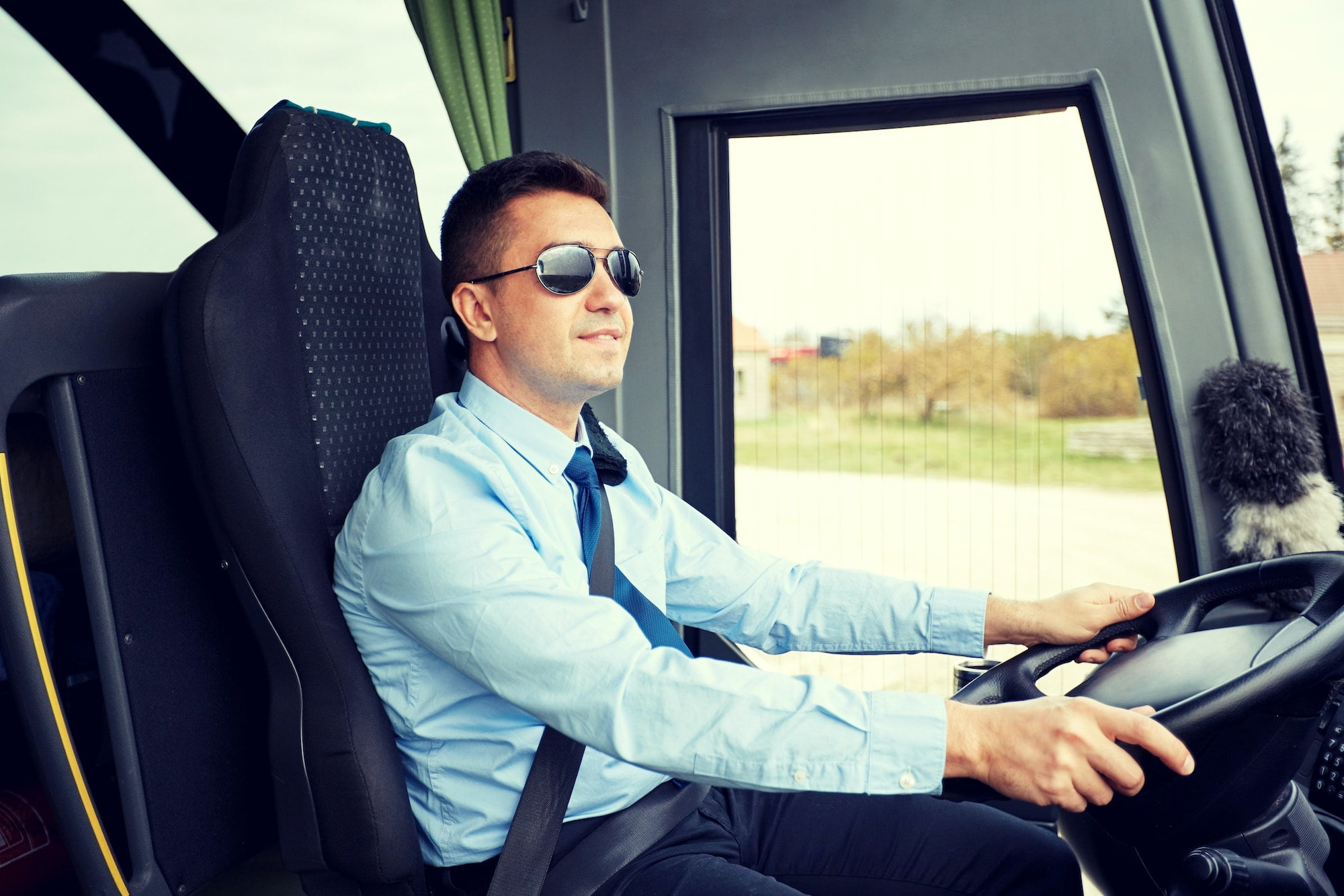 happy driver driving intercity bus